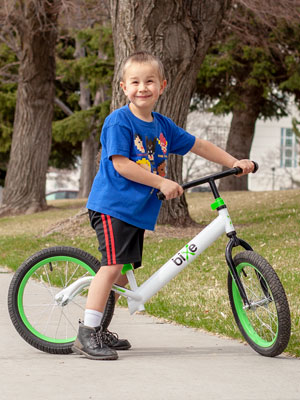 boy on large balance bike for kids 5 to 9 years 